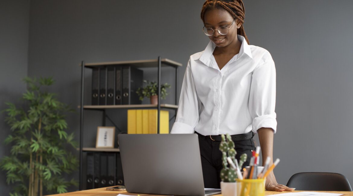 portrait-young-woman-working-her-laptop-startup-company