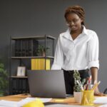 portrait-young-woman-working-her-laptop-startup-company